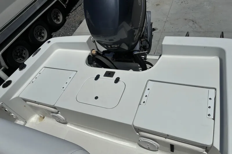Slide: The Image of 2014 Sea Hunt BX 20 BR boat with outboard motor and storage compartments. - 13