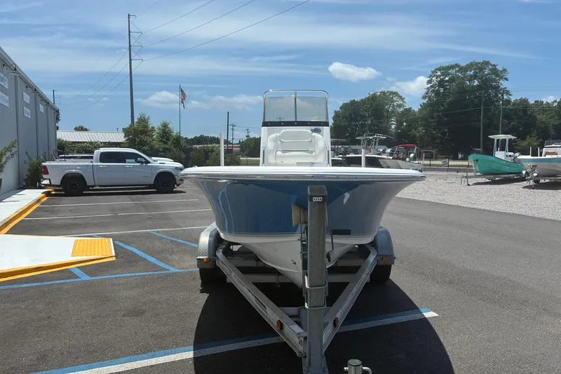 Slide: The Image of 2014 Sea Hunt BX 20 BR boat on trailer in parking lot, sunny day. - 19