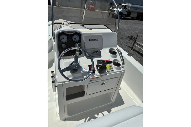 Slide: The Image of 2014 Sea Hunt BX 20 BR boat console with steering wheel and gauges. - 4