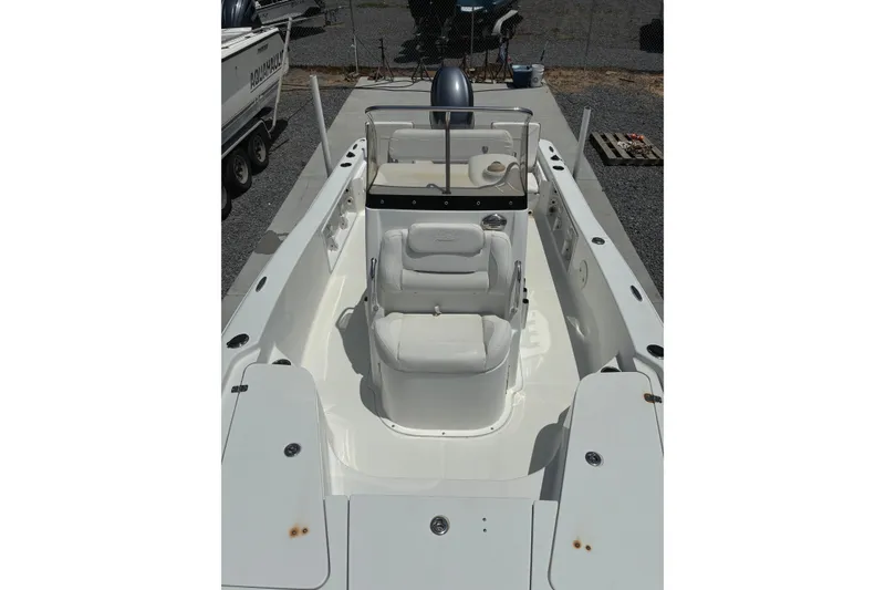 Slide: The Image of 2014 Sea Hunt BX 20 BR boat interior with white seating and console. - 9