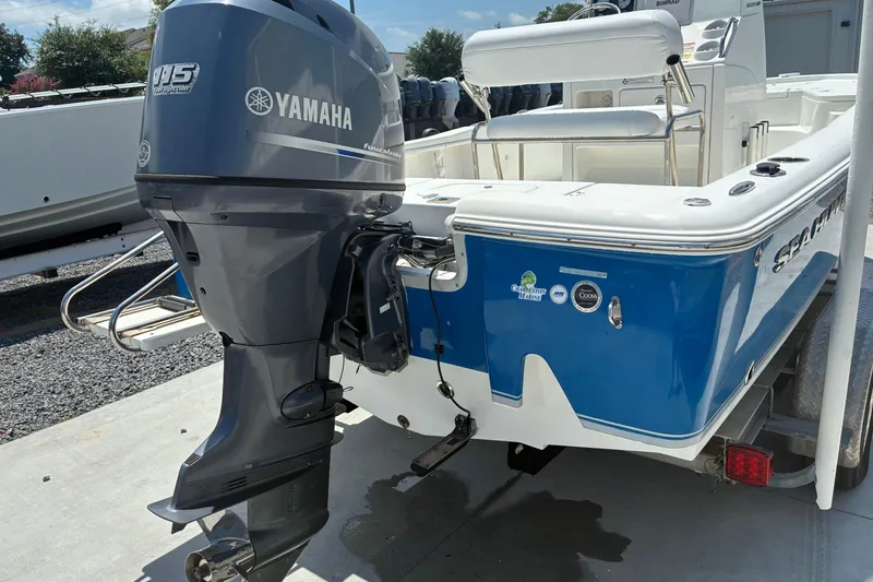 Slide: The Image of 2014 Sea Hunt BX 20 BR boat with Yamaha 115 engine, blue and white exterior. - 3
