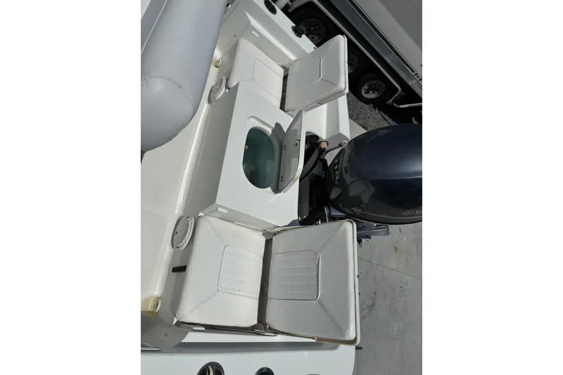 Slide: The Image of 2014 Sea Hunt BX 20 BR boat interior with seating and motor view. - 15