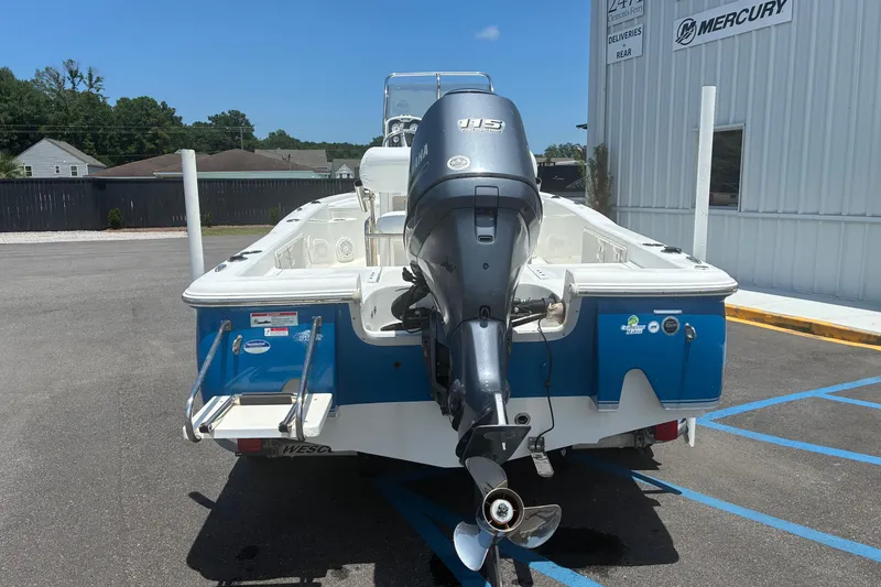 Slide: The Image of 2014 Sea Hunt BX 20 BR boat with Yamaha outboard motor in parking lot. - 20