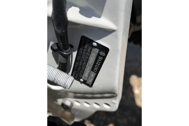 Slide: The Image of Close-up of a Suzuki motor label on a 2022 Achilles inflatable boat. - 6