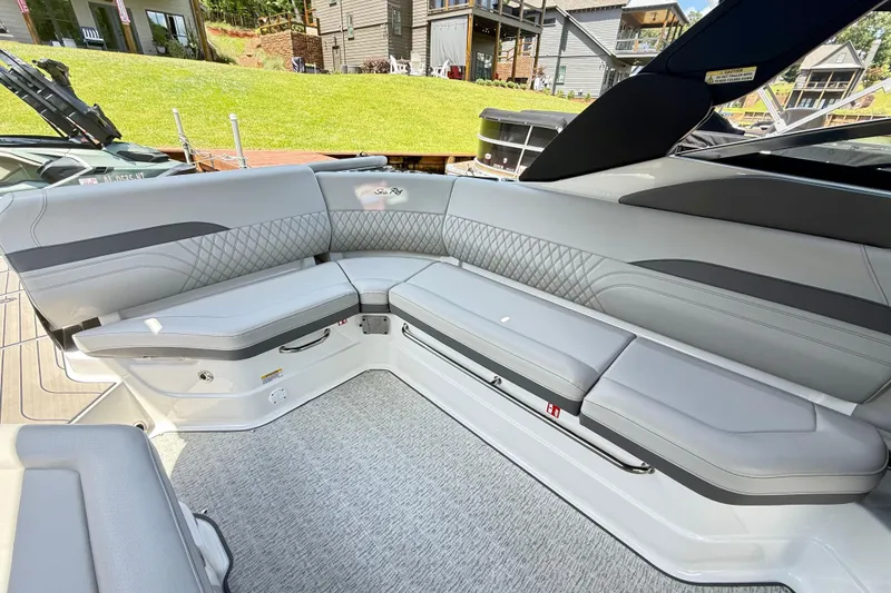 Slide: The Image of Luxurious seating area on the 2025 Sea Ray SLX 280 boat, featuring elegant gray upholstery. - 26
