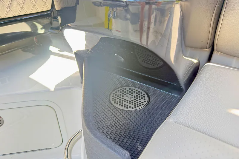 Slide: The Image of Interior detail of 2025 Sea Ray SLX 280 boat, featuring speaker and seating area. - 27