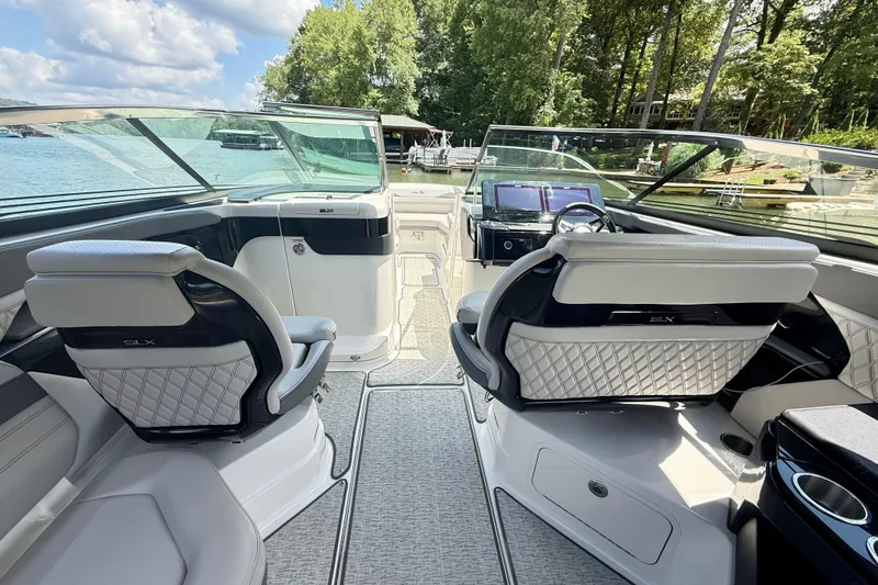 Slide: The Image of Interior of 2025 Sea Ray SLX 280 boat with luxurious seating and modern dashboard. - 12