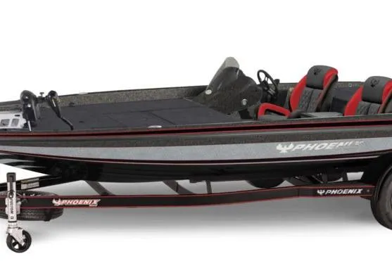 The Image of 2027 Phoenix 721 ZXL boat with sleek design and red-accented seats on trailer. - 2