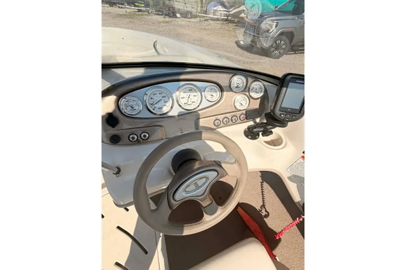 Slide: The Image of Steering console of a 2006 Tahoe Q6 Sport boat with gauges and navigation system. - 3