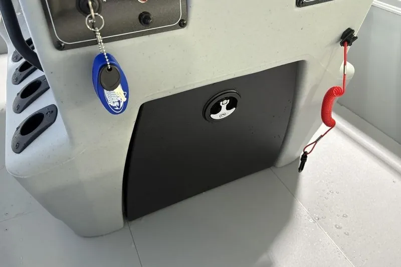 Slide: The Image of 2026 Tracker Bass Tracker Classic CC console with key and safety lanyard. - 16