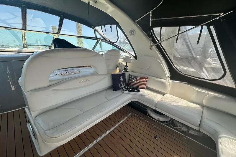 Slide: The Image of Luxurious interior of 2001 Sea Ray 410 Sundancer yacht with white seating and nautical decor. - 3