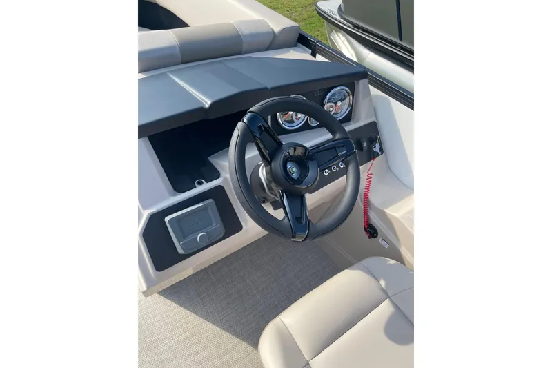 Slide: The Image of Steering wheel and dashboard of 2026 Alera A22 boat, featuring modern controls and gauges. - 7