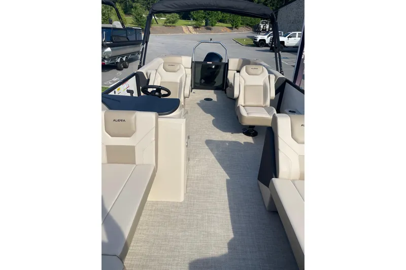 Slide: The Image of Interior view of 2026 Alera A22 boat with beige seating and steering console. - 10