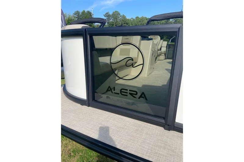 Slide: The Image of 2026 Alera A22 boat with sleek design and logo, featuring spacious interior. - 9
