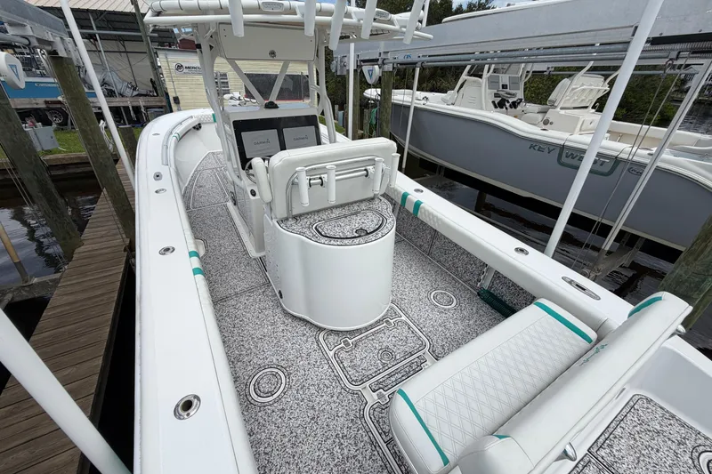 Slide: The Image of 2002 Yellowfin 31 Center Console boat with modern seating and navigation equipment. - 47