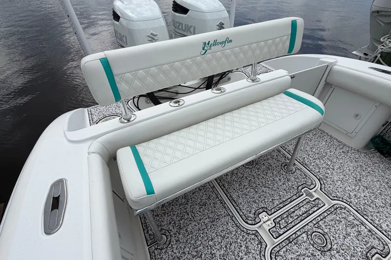 Slide: The Image of 2002 Yellowfin 31 Center Console boat with custom seating and Suzuki engines. - 18
