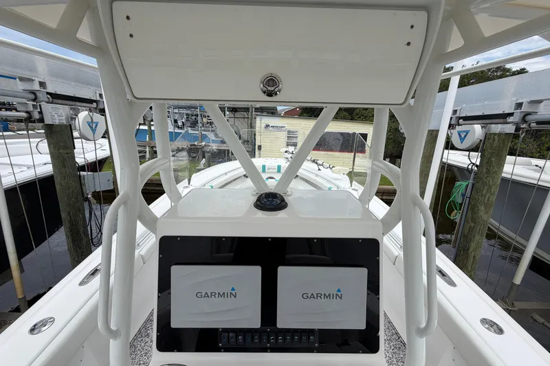 Slide: The Image of 2002 Yellowfin 31 Center Console boat with Garmin navigation system at dock. - 44
