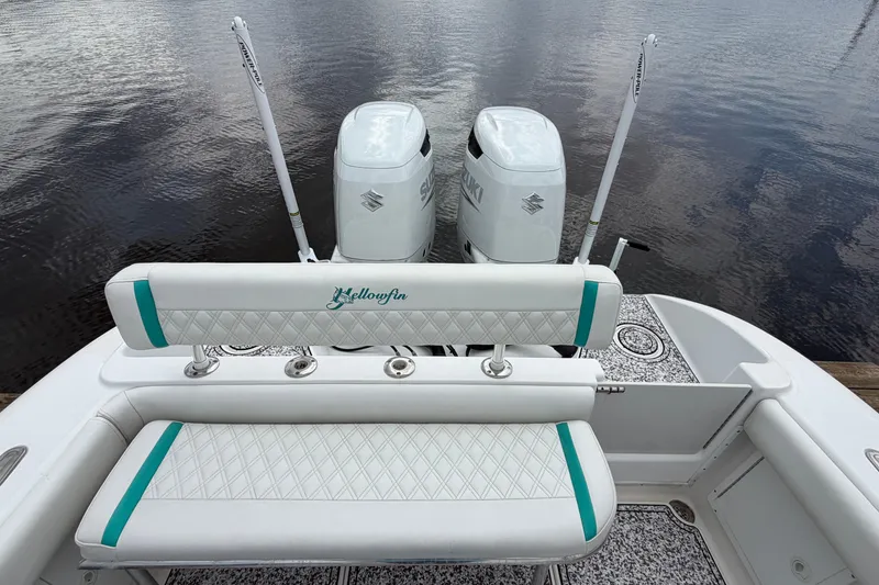 Slide: The Image of 2002 Yellowfin 31 Center Console boat with dual Suzuki engines, featuring stylish seating. - 17