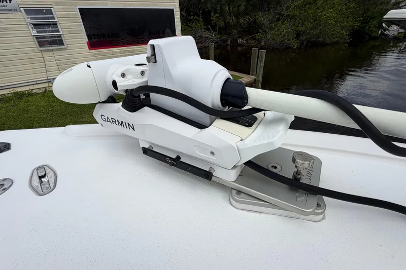 Slide: The Image of Garmin equipment on 2002 Yellowfin 31 Center Console boat, docked near water. - 33