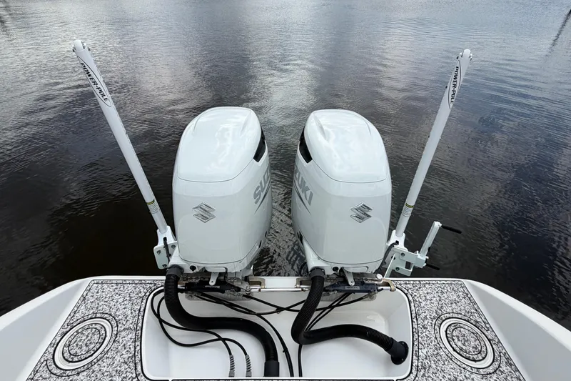 Slide: The Image of Twin Suzuki outboard engines on a 2002 Yellowfin 31 Center Console boat. - 16