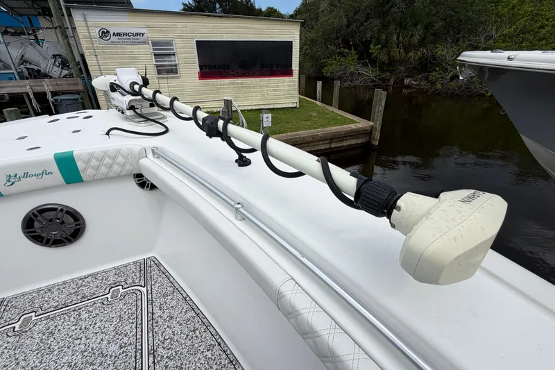 Slide: The Image of 2002 Yellowfin 31 Center Console boat with trolling motor docked near Mercury service building. - 34