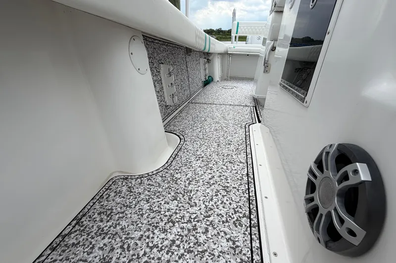 Slide: The Image of Interior view of a 2002 Yellowfin 31 Center Console boat with patterned flooring. - 31