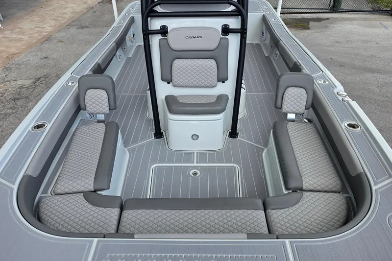 Slide: The Image of 2025 Caymas 281 HB boat interior with gray quilted seating and sleek design. - 17