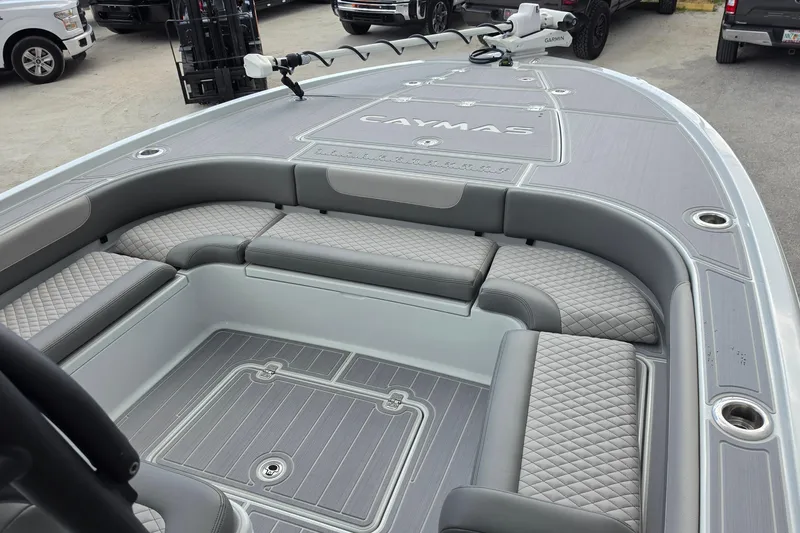 Slide: The Image of 2025 Caymas 281 HB boat interior with gray seating and deck, featuring modern design elements. - 15