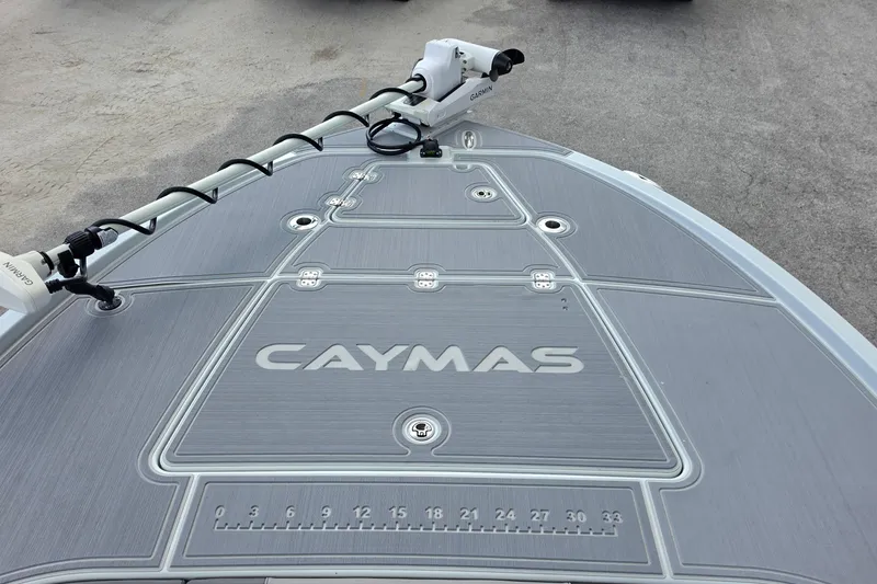 Slide: The Image of 2025 Caymas 281 HB boat deck with Garmin equipment, featuring sleek design and integrated ruler. - 16