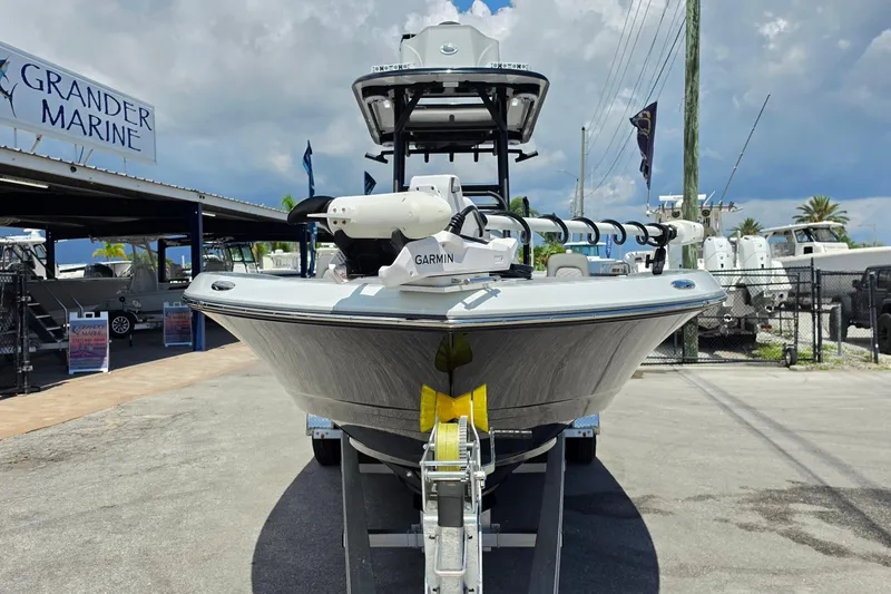 Slide: The Image of 2025 Caymas 281 HB boat at Grander Marine dealership, featuring Garmin equipment. - 8