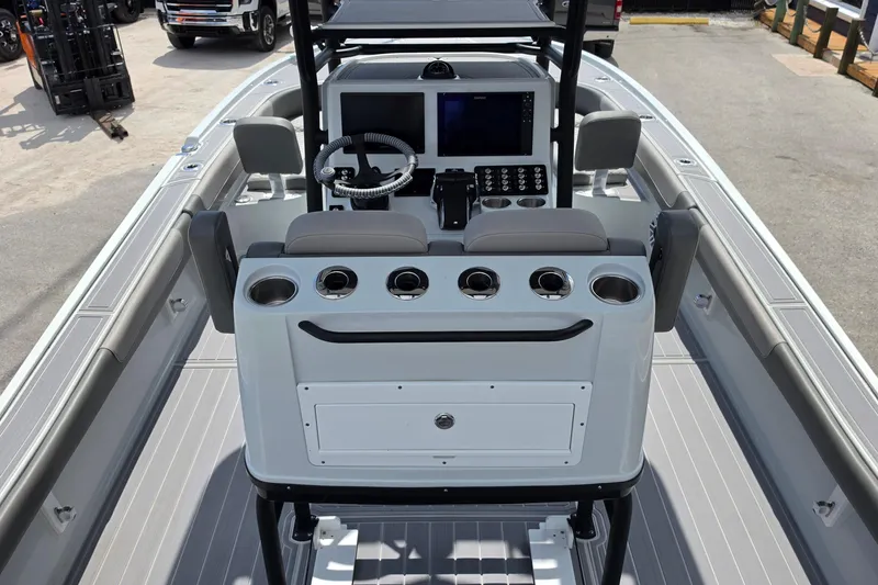 Slide: The Image of 2025 Caymas 281 HB boat interior with modern console and steering wheel. - 10