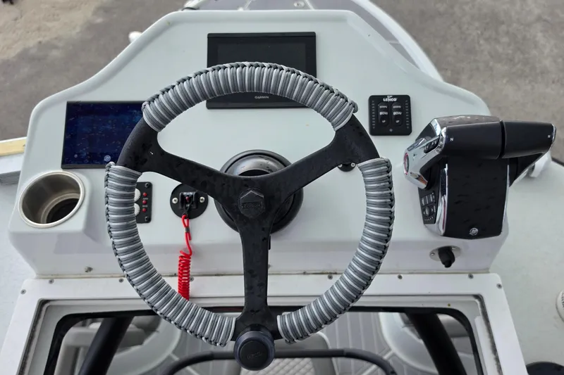 Slide: The Image of Steering console of 2025 Caymas 281 HB boat with modern controls and navigation system. - 19
