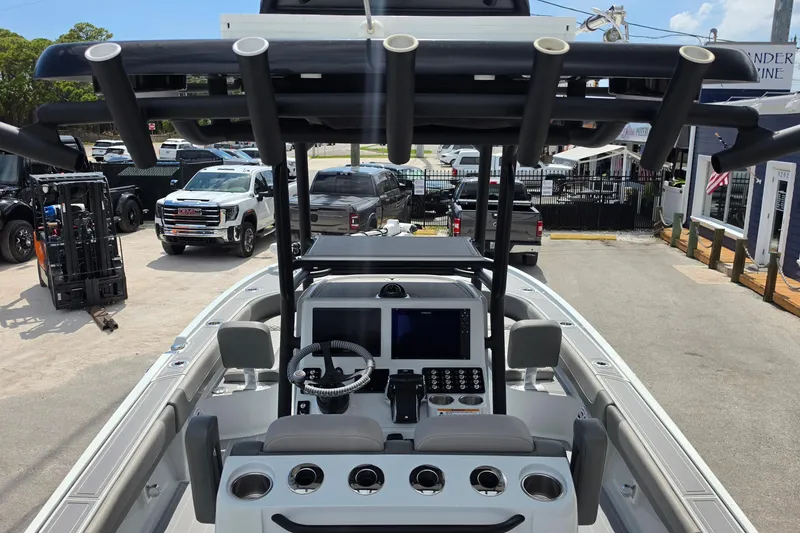 Slide: The Image of 2025 Caymas 281 HB boat interior with modern dashboard and steering wheel. - 9