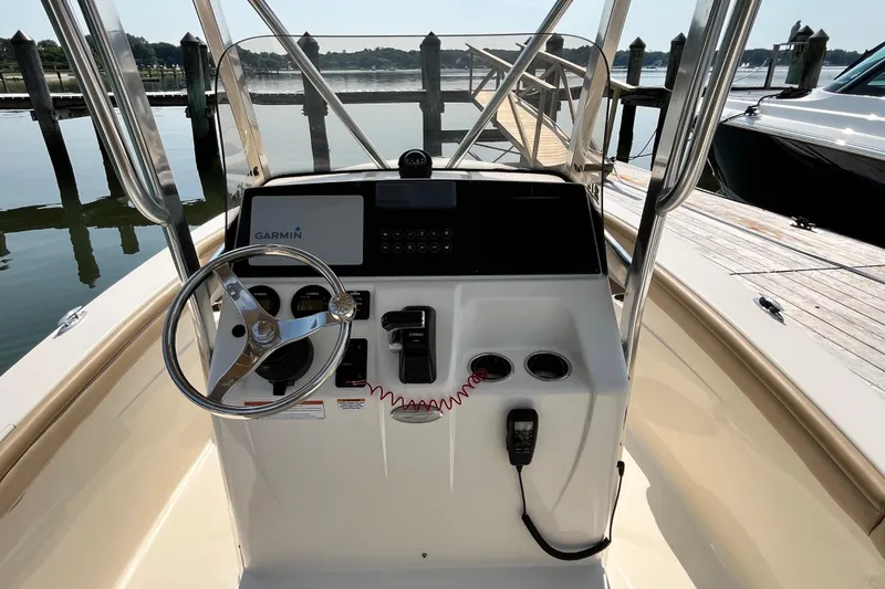 Slide: The Image of 2021 Scout 215 XSF boat helm with Garmin navigation system at dock. - 18