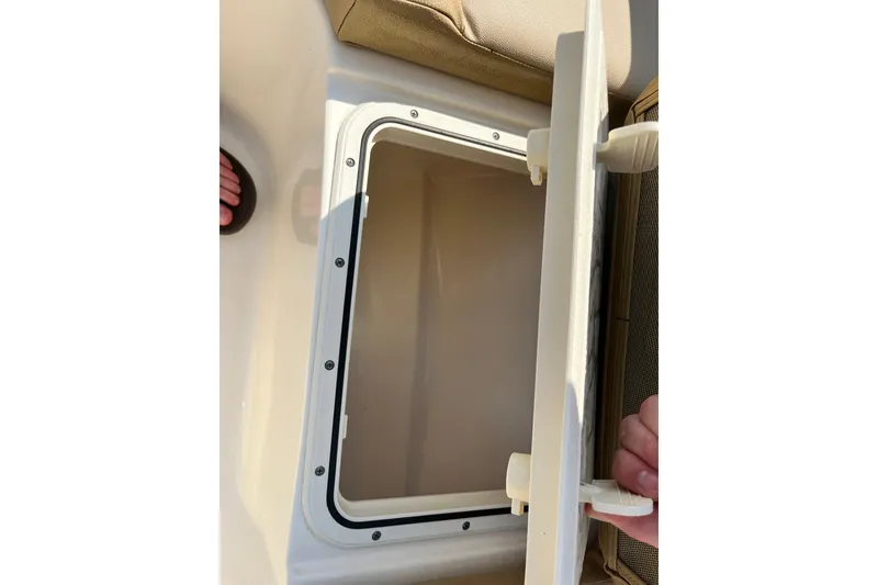 Slide: The Image of Open storage compartment on a 2021 Scout 215 XSF boat, showcasing interior space. - 33