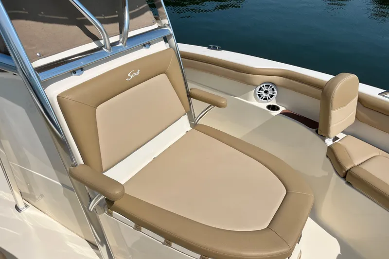 Slide: The Image of 2021 Scout 215 XSF boat interior with tan seating and stainless steel accents. - 20