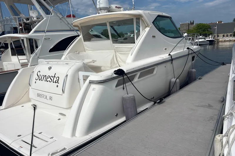 Slide: The Image of 2012 Tiara Yachts 3900 Sovran docked, featuring sleek design and white exterior. - 11