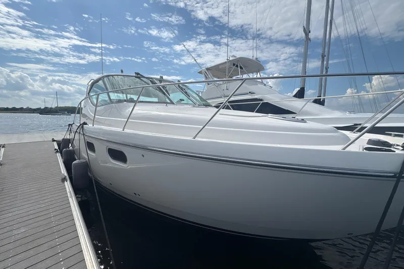Slide: The Image of 2012 Tiara Yachts 3900 Sovran docked under a partly cloudy sky. - 12