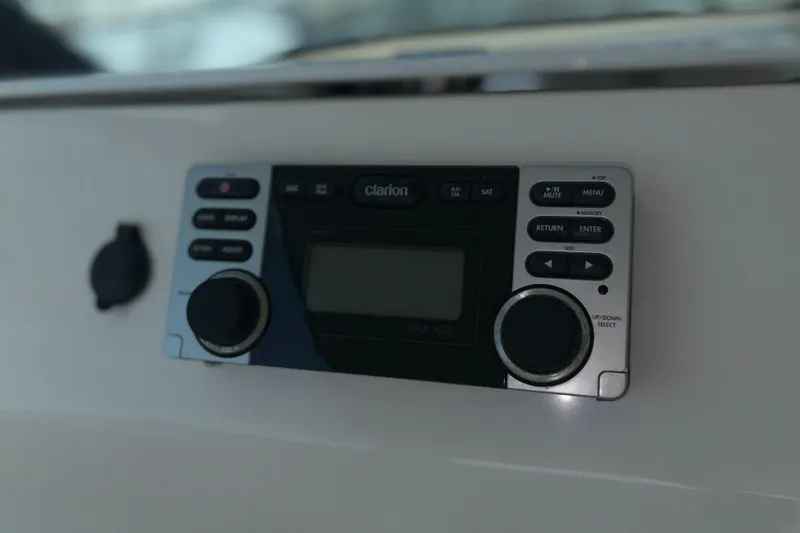 Slide: The Image of Clarion audio system on 2012 Tiara Yachts 3900 Sovran dashboard. - 18