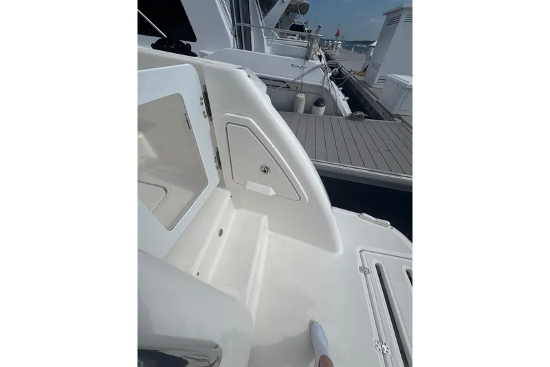 Slide: The Image of 2012 Tiara Yachts 3900 Sovran yacht deck, featuring sleek design and dockside view. - 24