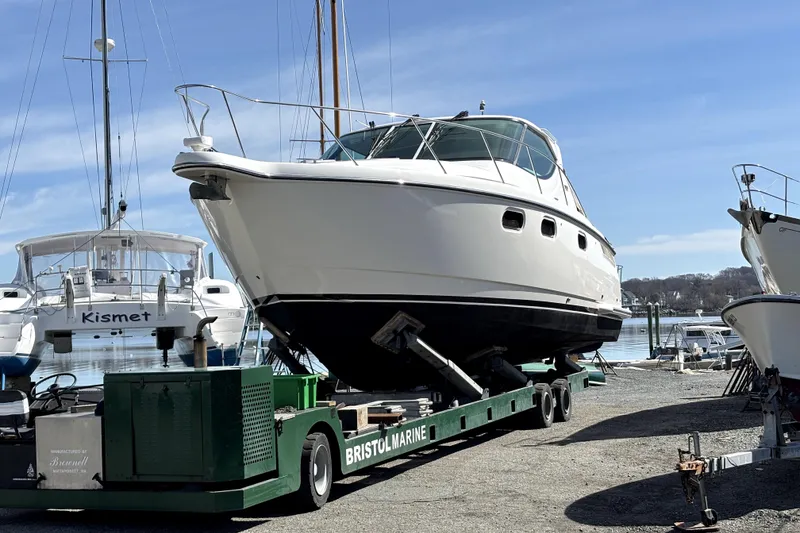 Slide: The Image of 2012 Tiara Yachts 3900 Sovran on trailer at marina, clear sky background. - 9