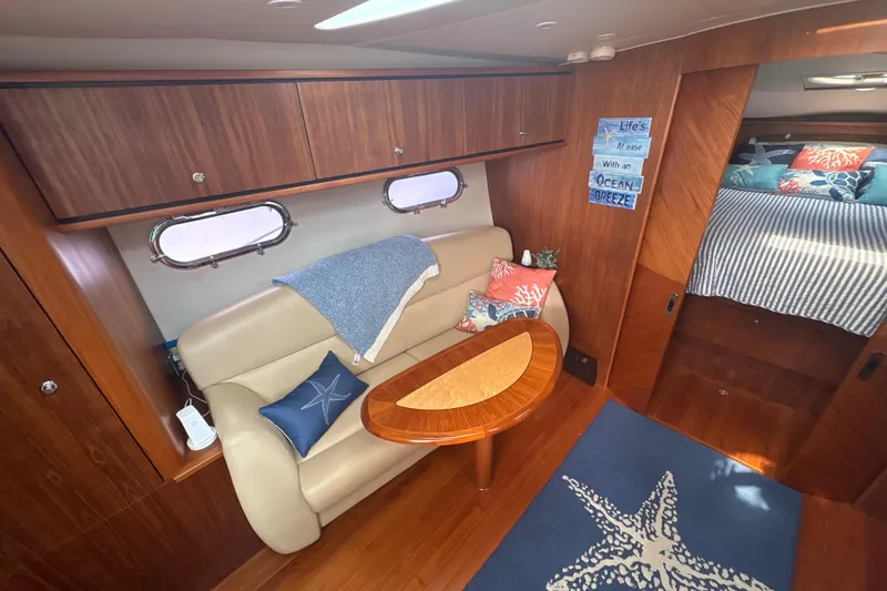 Slide: The Image of Luxurious 2012 Tiara Yachts 3900 Sovran interior with cozy seating and nautical decor. - 33