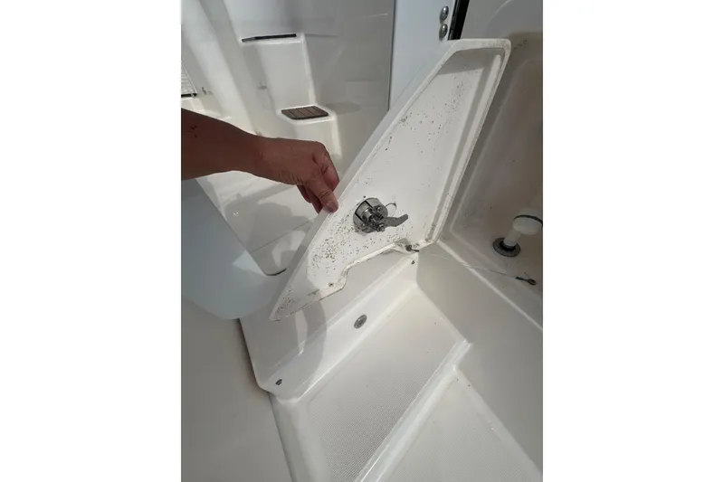 Slide: The Image of 2012 Tiara Yachts 3900 Sovran deck detail with open hatch and hand. - 23