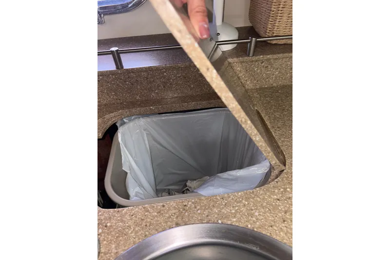 Slide: The Image of Built-in trash bin on 2012 Tiara Yachts 3900 Sovran kitchen counter. - 45