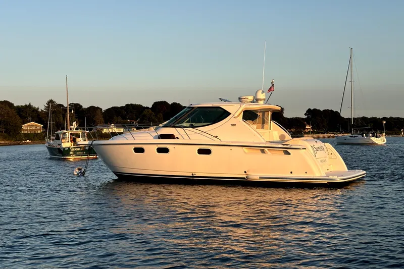 Slide: The Image of 2012 Tiara Yachts 3900 Sovran cruising on calm waters at sunset. - 1