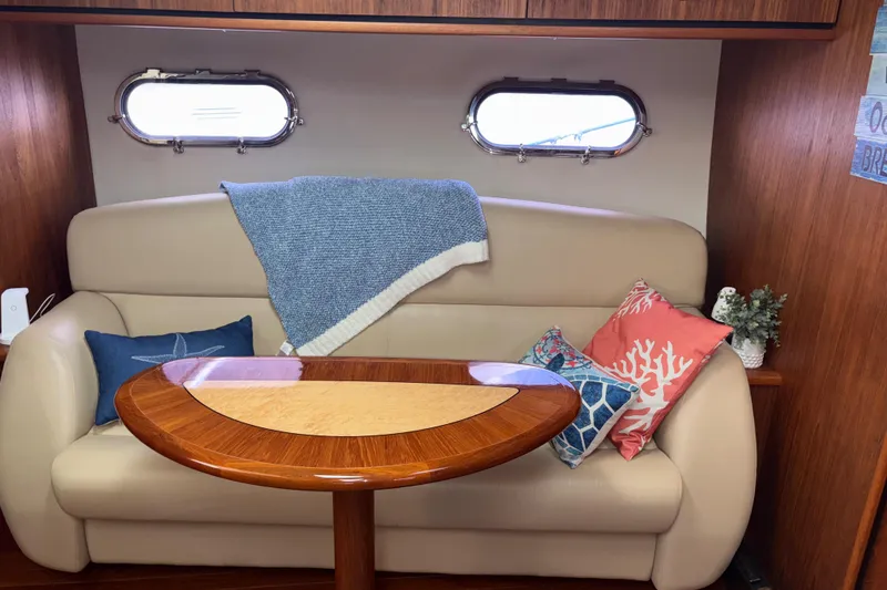 Slide: The Image of Interior of 2012 Tiara Yachts 3900 Sovran with cozy seating and decorative pillows. - 39