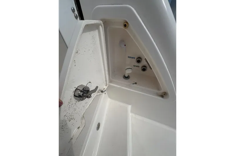Slide: The Image of 2012 Tiara Yachts 3900 Sovran water access panel with fresh and raw water controls. - 22