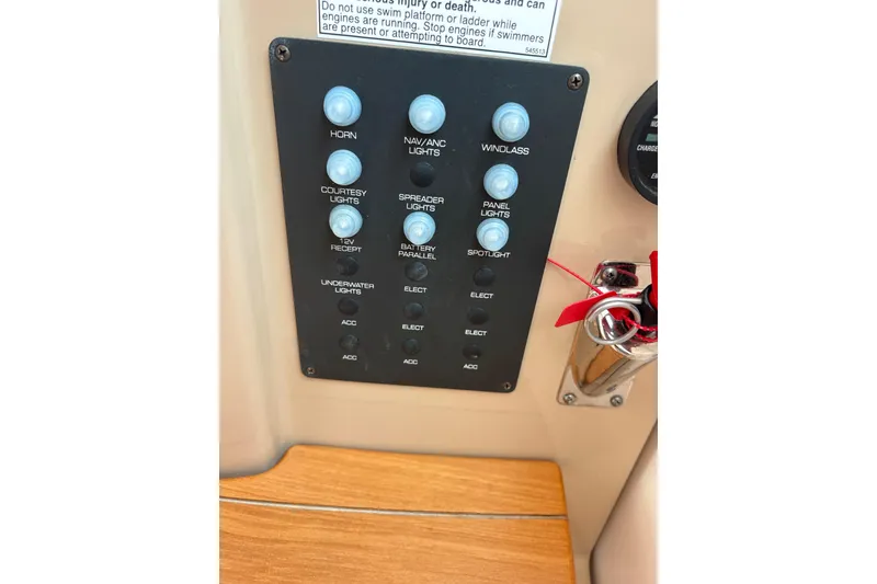 Slide: The Image of Control panel of a 2012 Tiara Yachts 3900 Sovran with labeled switches. - 49