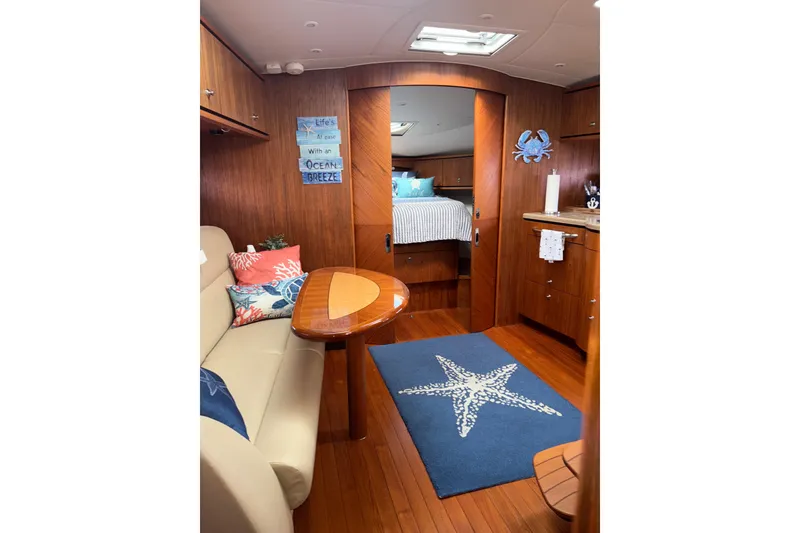 Slide: The Image of Interior of 2012 Tiara Yachts 3900 Sovran with cozy seating and nautical decor. - 42