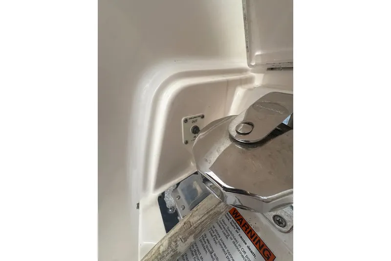 Slide: The Image of Close-up of a 2012 Tiara Yachts 3900 Sovran boat's chrome hardware and warning label. - 25